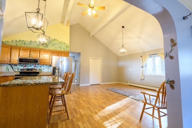 kitchen with stainless steel appliances, a baseboard radiator, pendant lighting, and a kitchen bar