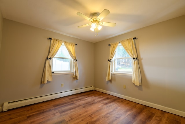 empty room featuring ceiling fan, a baseboard radiator, and wood-type flooring