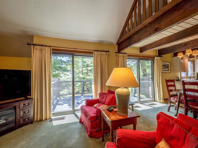 living room featuring beamed ceiling, carpet floors, wood ceiling, and sink