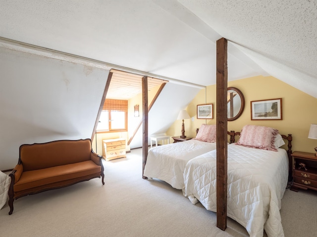 carpeted bedroom with a textured ceiling and vaulted ceiling