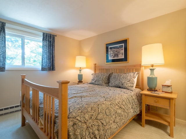 bedroom featuring carpet floors and a baseboard heating unit