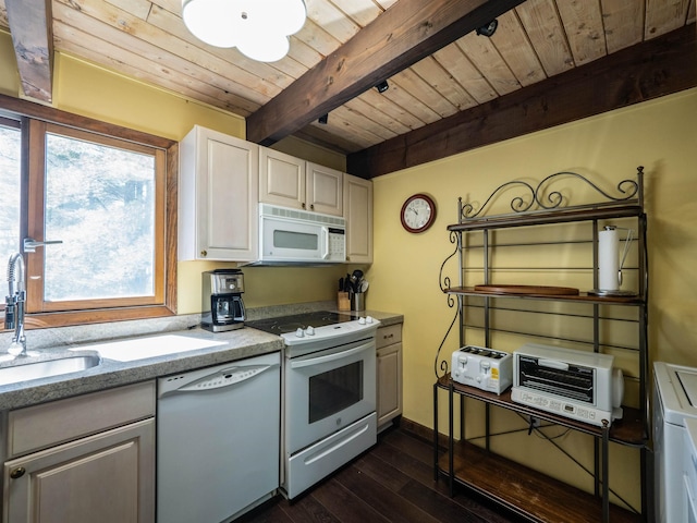 kitchen featuring a wealth of natural light, white appliances, dark wood-type flooring, beam ceiling, and white cabinets