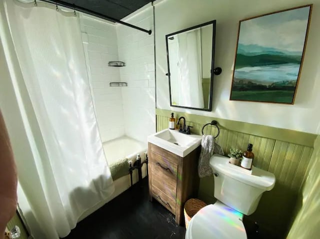 full bathroom featuring vanity, shower / bath combo, and toilet