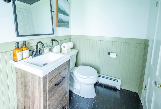 bathroom featuring hardwood / wood-style flooring, toilet, a baseboard radiator, and vanity