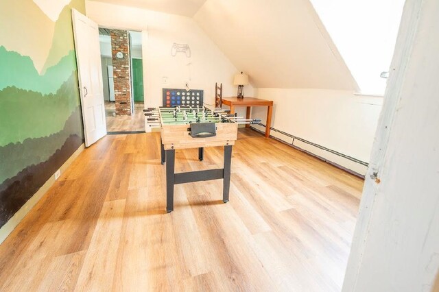 living room with built in shelves and light hardwood / wood-style floors