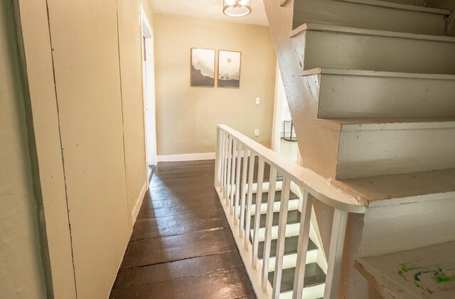 office space featuring hardwood / wood-style flooring, a wealth of natural light, and a baseboard heating unit