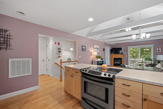 kitchen with an inviting chandelier, light wood-type flooring, light brown cabinets, stainless steel electric range, and hanging light fixtures