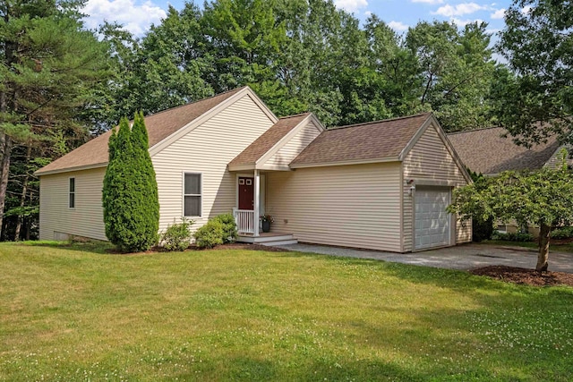 view of front of home with a garage and a front lawn