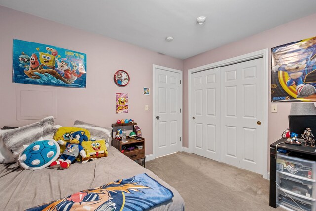 bedroom with carpet floors and a closet