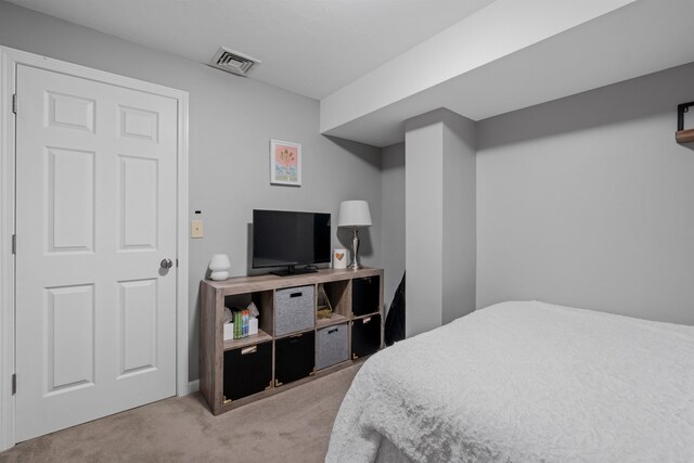 bedroom with light carpet