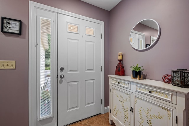 tiled entryway featuring plenty of natural light