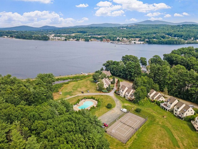 birds eye view of property featuring a water and mountain view