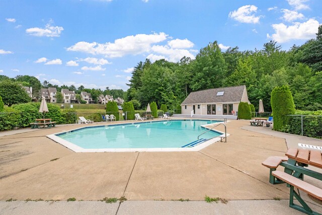 view of swimming pool featuring a patio