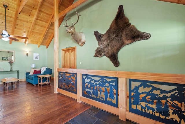 interior space featuring beamed ceiling, high vaulted ceiling, dark wood-type flooring, and wood ceiling