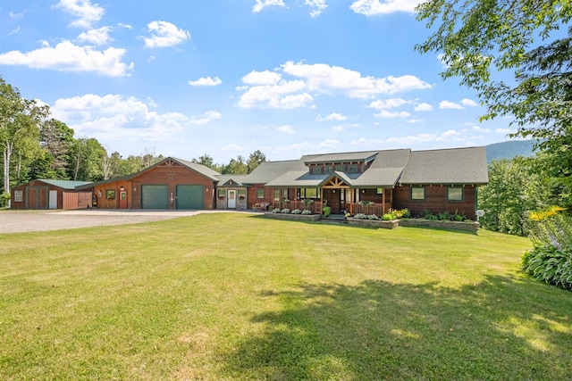 view of front facade featuring a garage, covered porch, and a front lawn