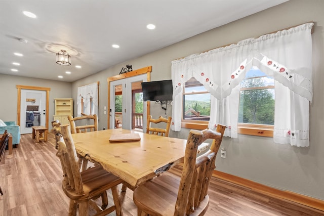 dining area with light hardwood / wood-style flooring