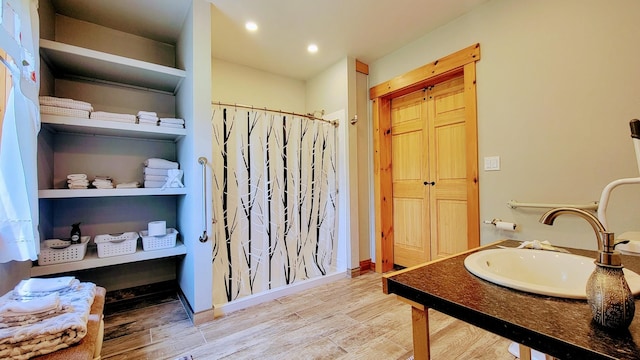 bathroom featuring vanity and hardwood / wood-style floors