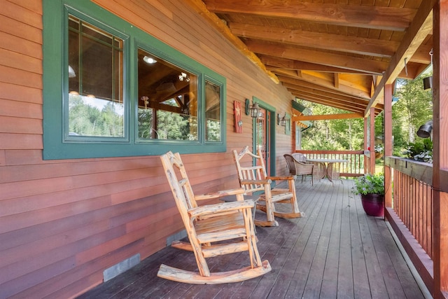 wooden terrace with a porch