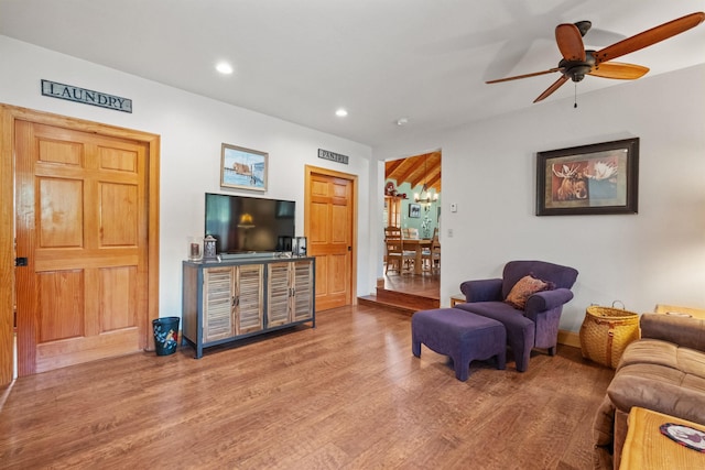 living room featuring hardwood / wood-style flooring and ceiling fan