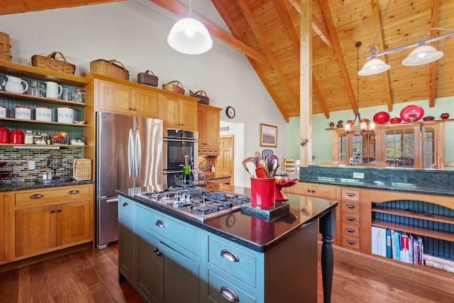 kitchen with dark hardwood / wood-style floors, stainless steel appliances, decorative light fixtures, and a center island