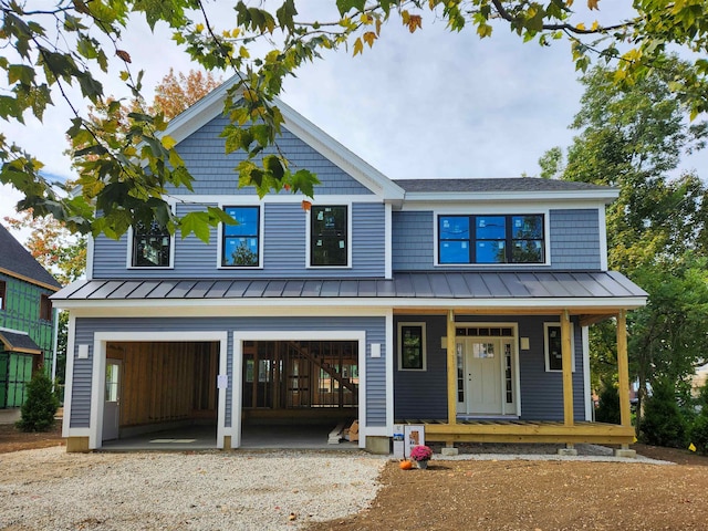 view of front of property with covered porch and a garage