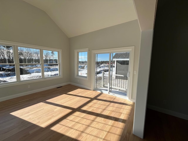 unfurnished sunroom with vaulted ceiling