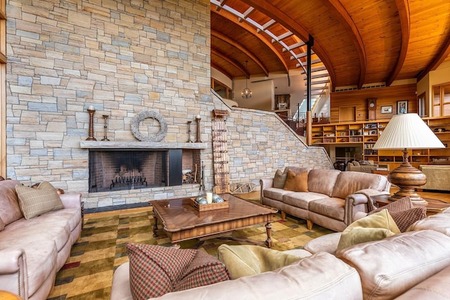 living room featuring a fireplace, brick ceiling, and vaulted ceiling with beams