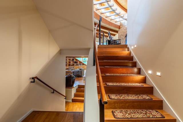 stairway featuring hardwood / wood-style floors