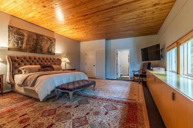 bedroom featuring vaulted ceiling and wooden ceiling