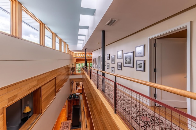 hall with wood-type flooring