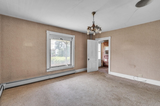 carpeted spare room with a baseboard heating unit and a notable chandelier