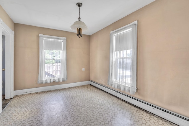 spare room featuring a baseboard radiator