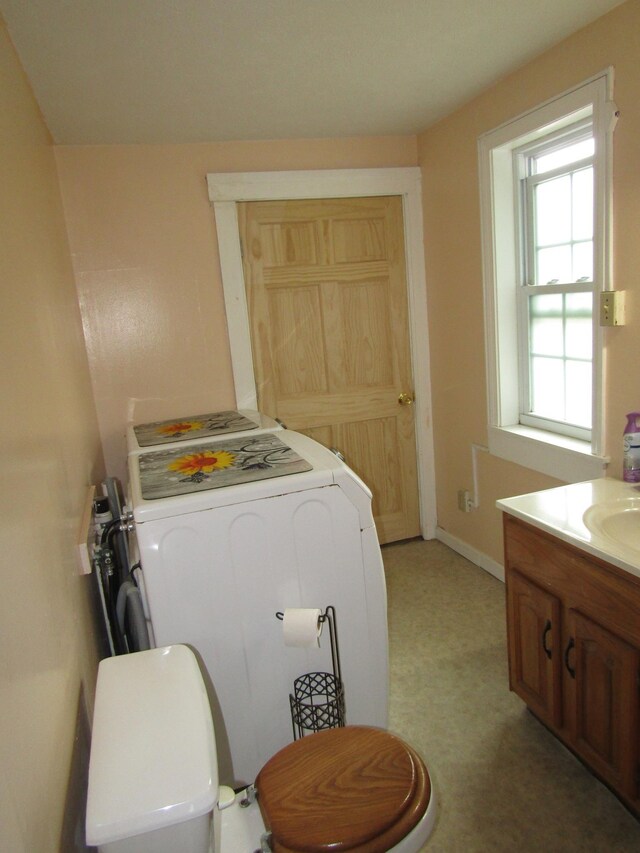 laundry room with sink and washer / clothes dryer