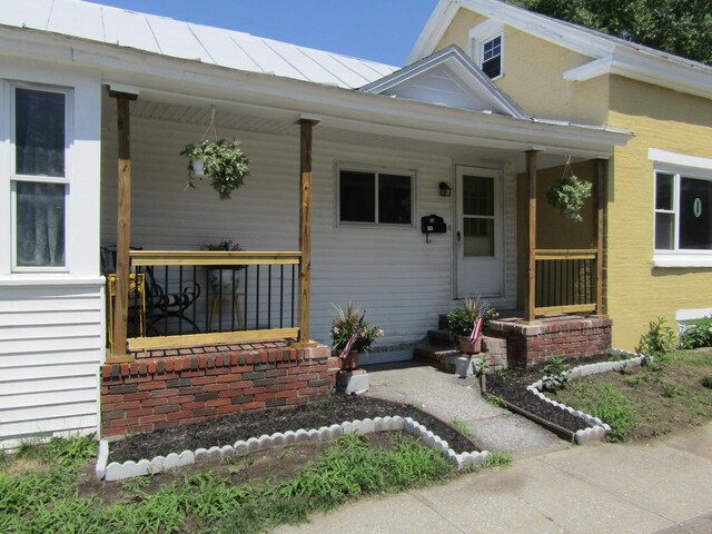 doorway to property featuring a porch