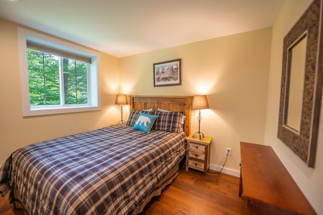 bedroom with wood-type flooring