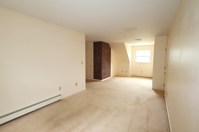 unfurnished living room with brick wall, light carpet, and baseboard heating