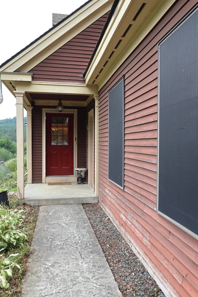 entrance to property featuring a porch