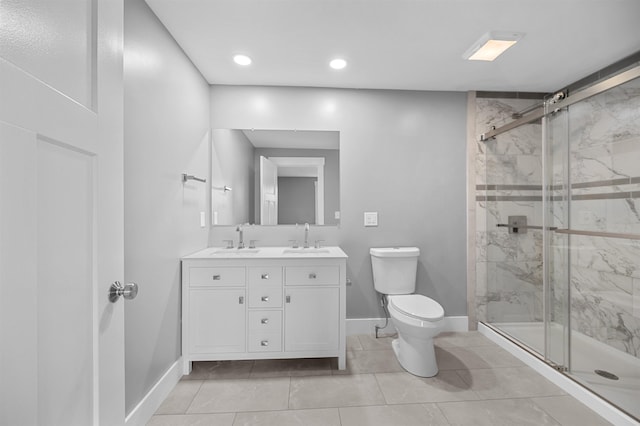 bathroom featuring walk in shower, vanity, and toilet