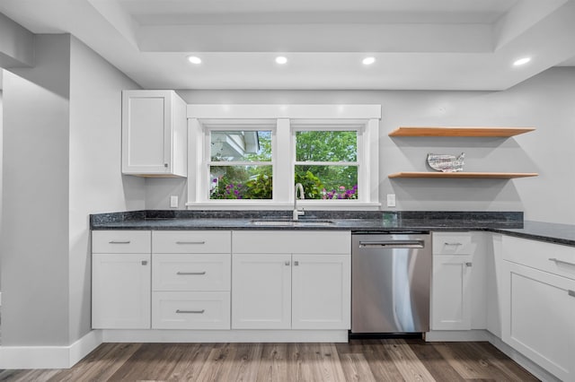 kitchen with white cabinetry, wood-type flooring, dishwasher, and sink