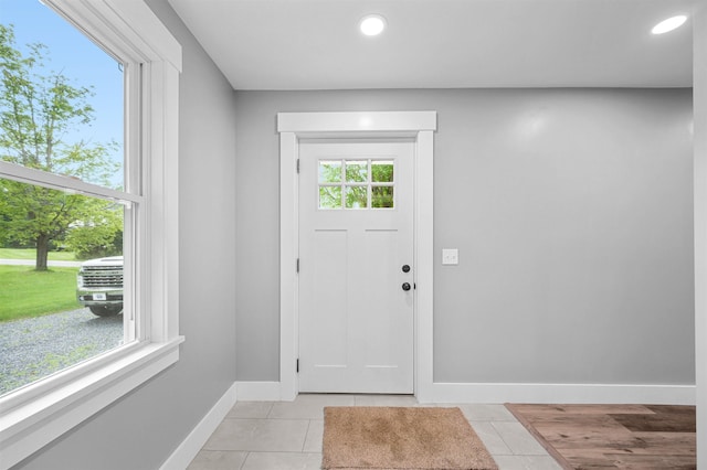 entrance foyer with light tile patterned floors