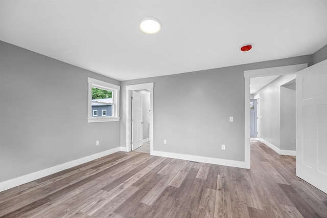 spare room with light hardwood / wood-style flooring