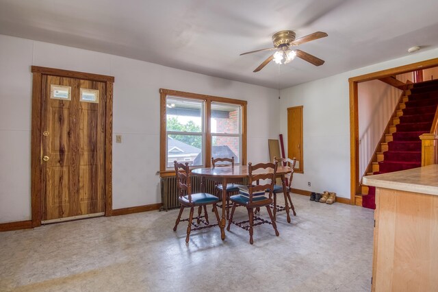 dining room with concrete flooring and ceiling fan