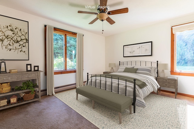 bedroom with a baseboard radiator, carpet, and ceiling fan