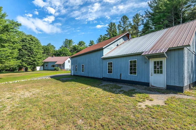 view of property exterior with a yard