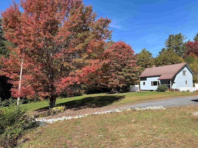 view of front of home with a front lawn