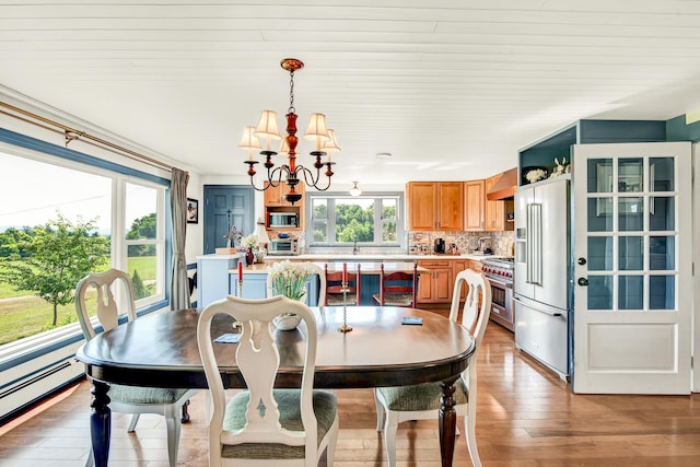 dining space with a baseboard radiator, wooden ceiling, a chandelier, and light wood-type flooring