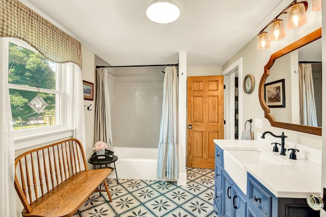 bathroom featuring vanity and shower / bath combo with shower curtain