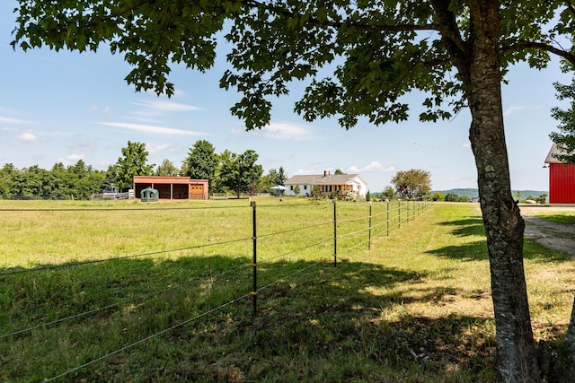 view of yard with a rural view