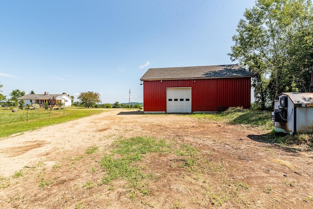 view of yard with an outbuilding and a garage