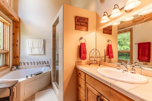 bathroom with plus walk in shower and vanity